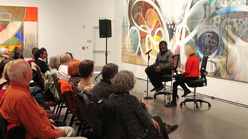 people in gallery for artist talk