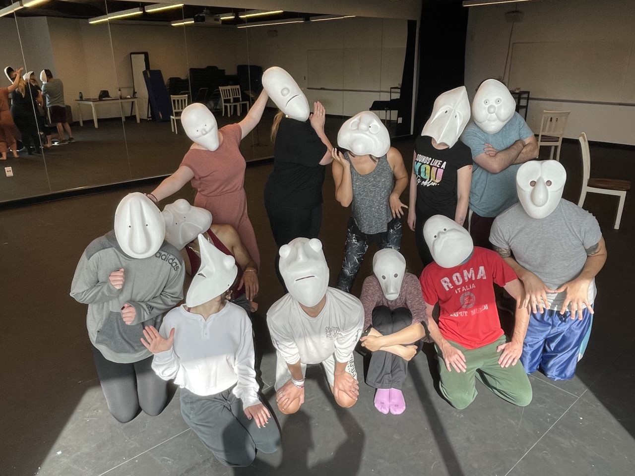 Acting studio with eleven people in masks