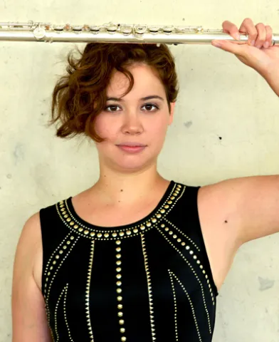 Élise Roy standing with flute