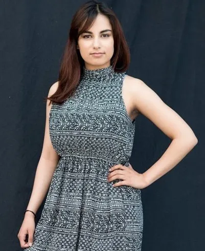 picture of aj vafiades in a floral print black dress