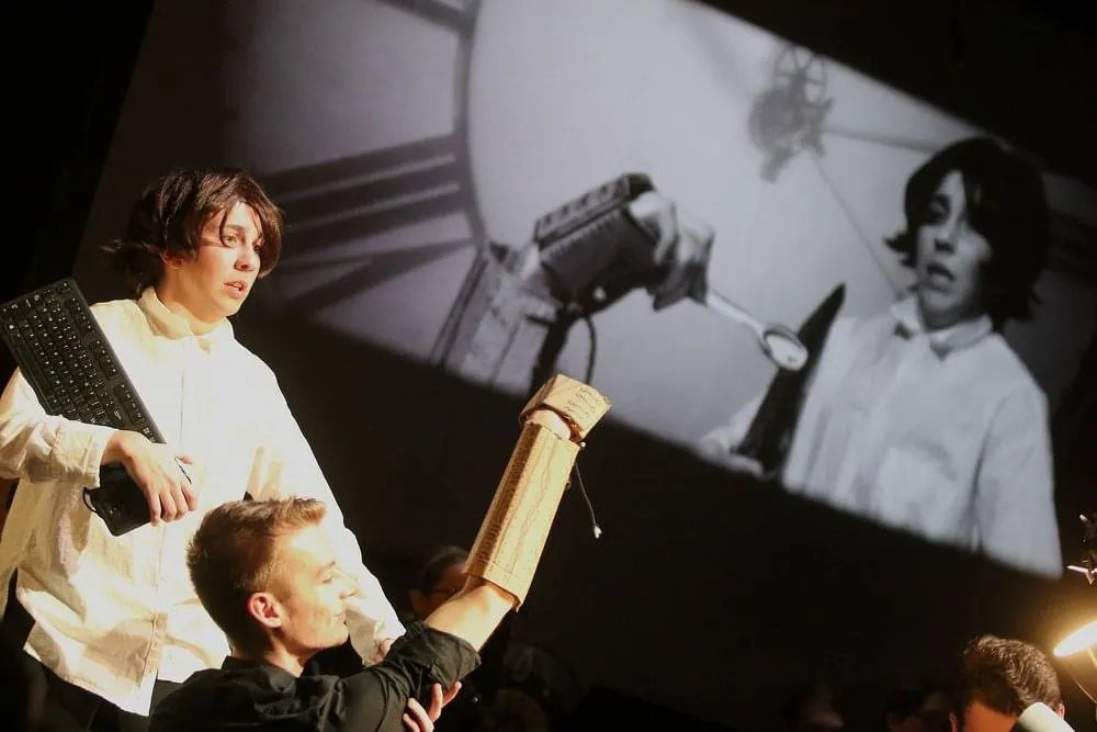 students on set and screen in Manual Cinema workshop