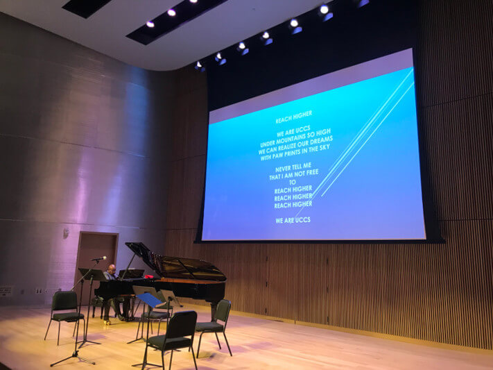 chapman foundations recital hall piano performance with screen in background