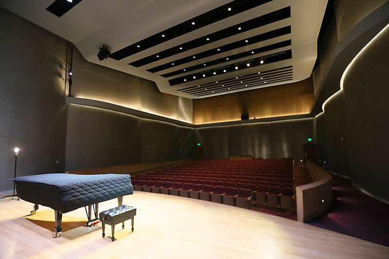 piano on stage in chapman foundations recital hall